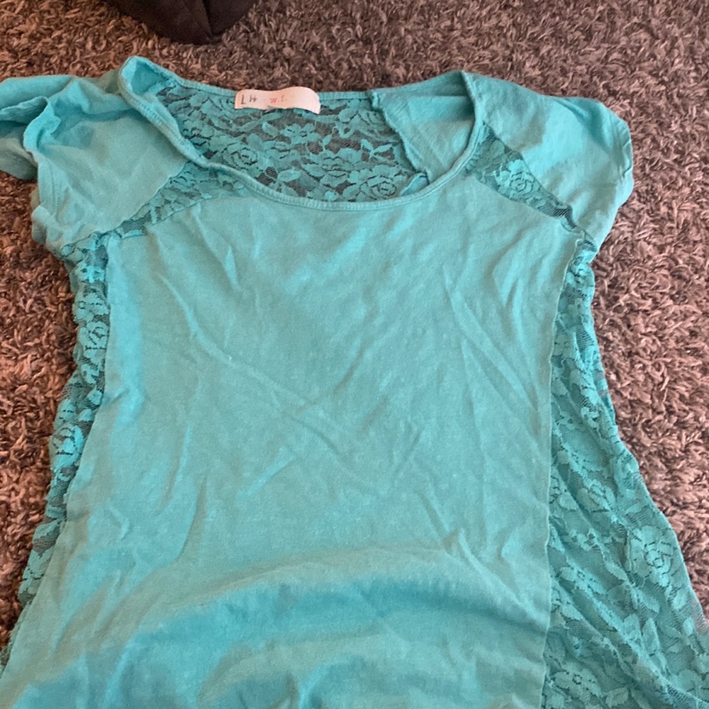 A blue W.F, shirt in a large